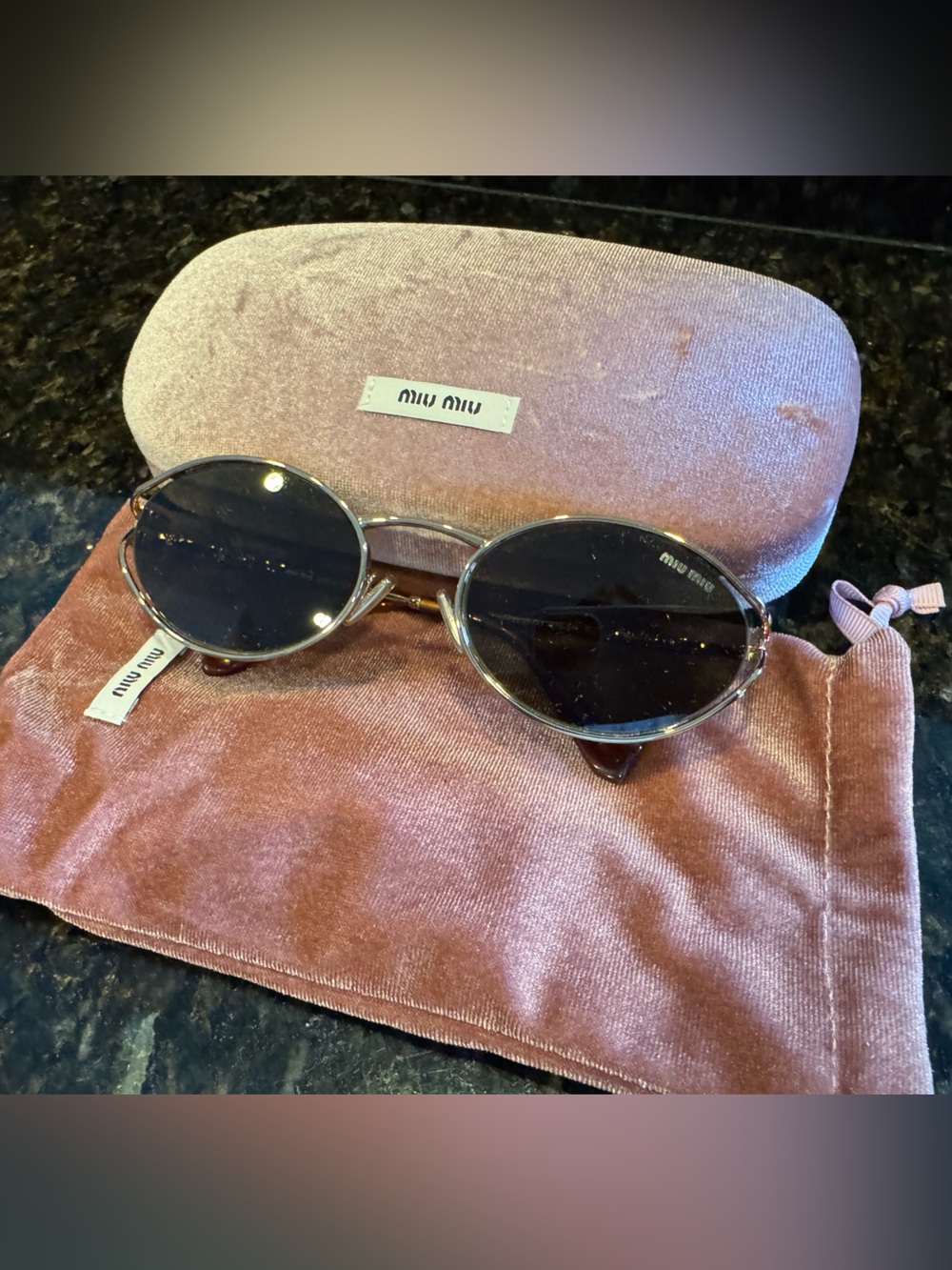 Miu Miu oval brown sunglasses
